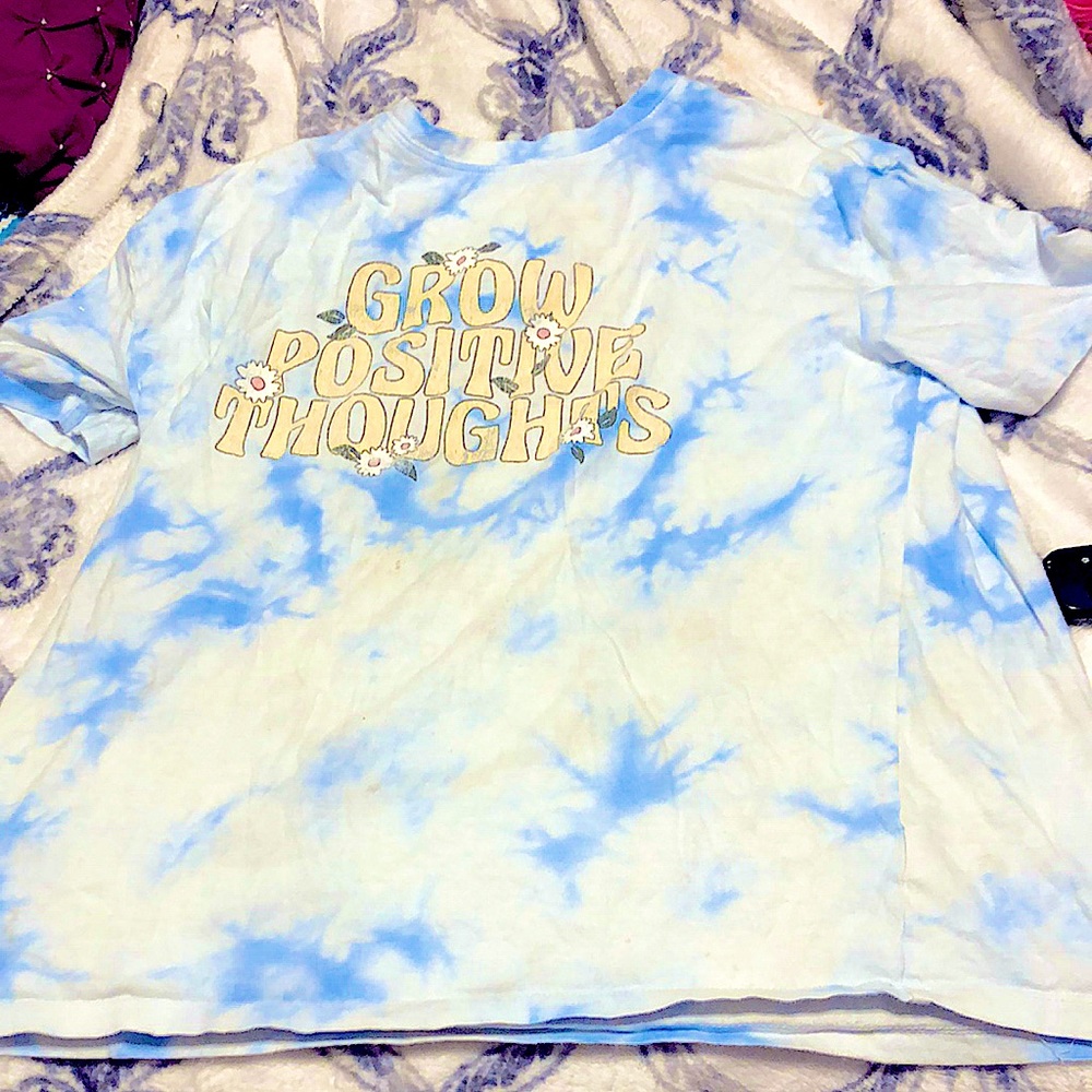 It is a kid shirt and in good condition it says grow positive thoughts
